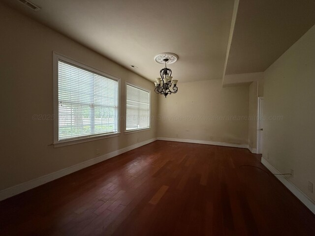 1068 Old Zion Loop, Nauvoo, AL 35578 - unfurnished dining area with a chandelier and wood finished floors
