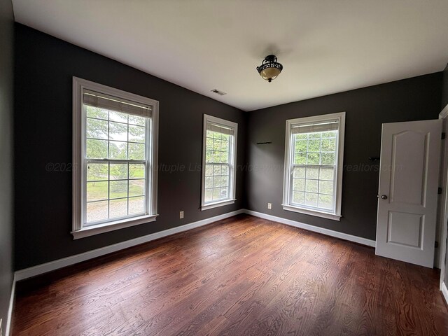 1068 Old Zion Loop, Nauvoo, AL 35578 - empty room with dark wood finished floors and baseboards