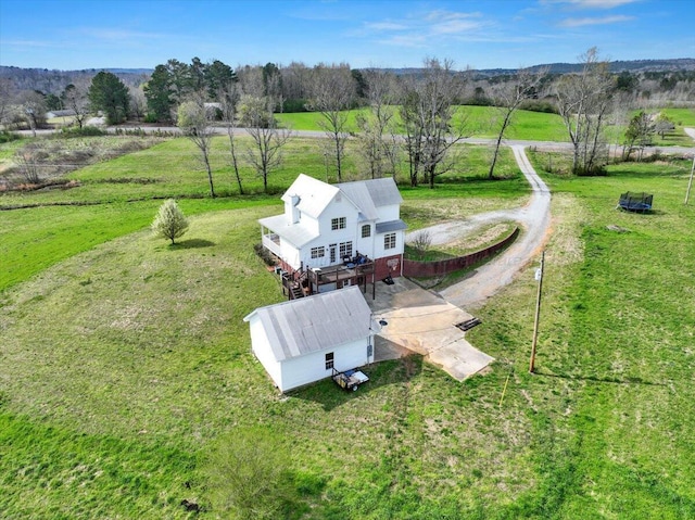 birds eye view of property featuring a rural view