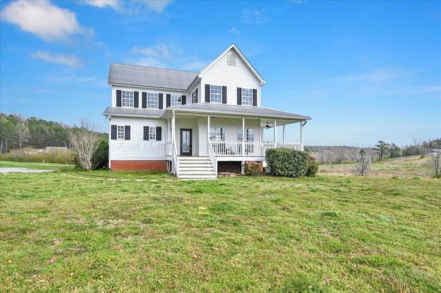 view of front of house with covered porch and a front yard