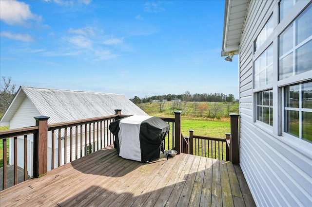 wooden deck featuring grilling area and a rural view