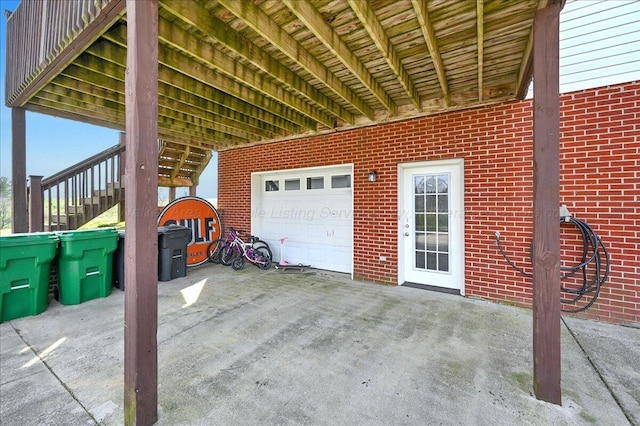 view of patio featuring a garage