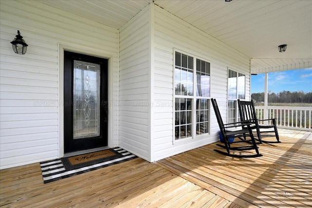 doorway to property featuring covered porch