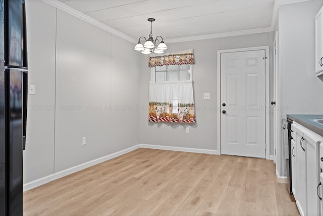 unfurnished dining area featuring light wood finished floors, baseboards, crown molding, and a chandelier