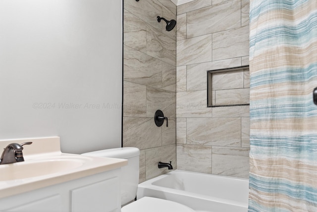 full bath featuring shower / bath combo with shower curtain, vanity, and toilet