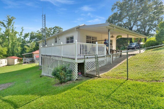 805 3rd Ave, Jasper, AL 35501 - view of home's exterior with a wooden deck and a carport