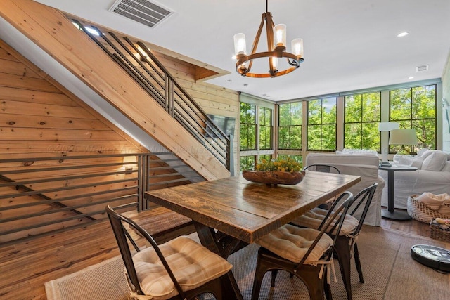 134 Turtle Point Dr, Crane Hill, AL 35053 - dining room with a chandelier, stairway, hardwood / wood-style floors, recessed lighting, and wood walls