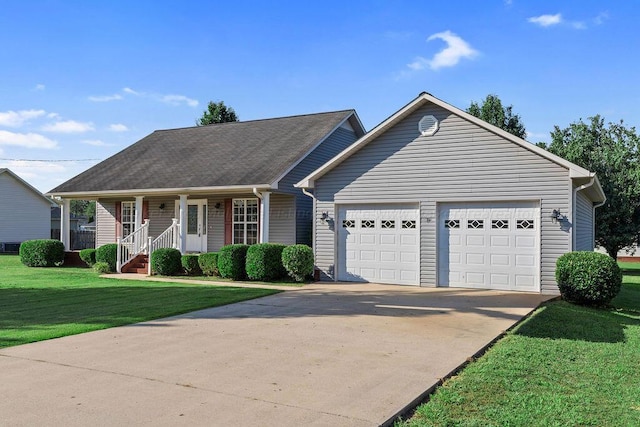 view of front of property with a garage, covered porch, and a front yard