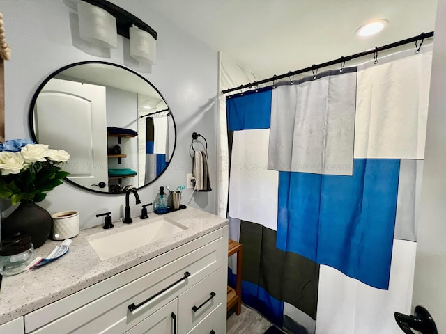 bathroom with vanity and curtained shower