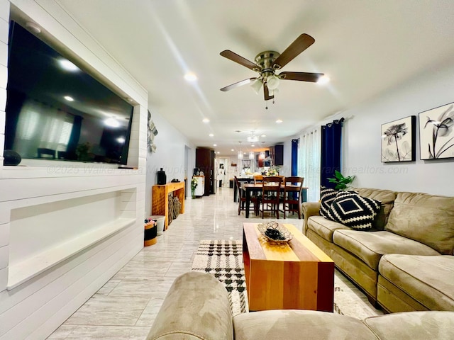 living room with a ceiling fan and recessed lighting