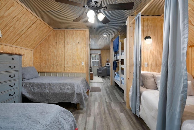 1433 Sipsey Pines Rd, Arley, AL 35540 - bedroom featuring wood walls, wood finished floors, wooden ceiling, lofted ceiling, and a ceiling fan