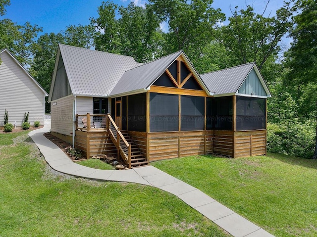 1433 Sipsey Pines Rd, Arley, AL 35540 - view of front of property with a sunroom, a front lawn, and metal roof