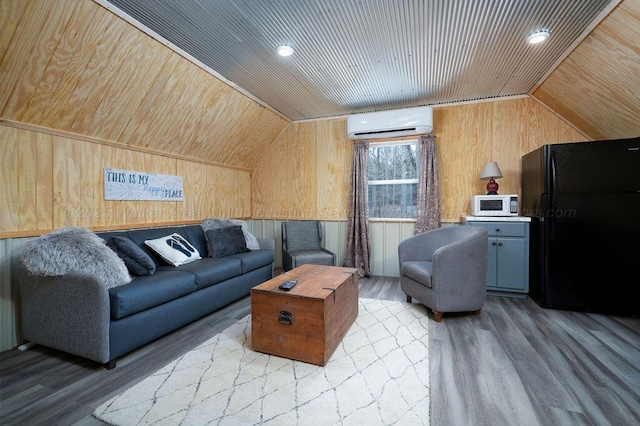 1433 Sipsey Pines Rd, Arley, AL 35540 - living area featuring a wall unit AC, wooden walls, wooden ceiling, vaulted ceiling, and wood finished floors