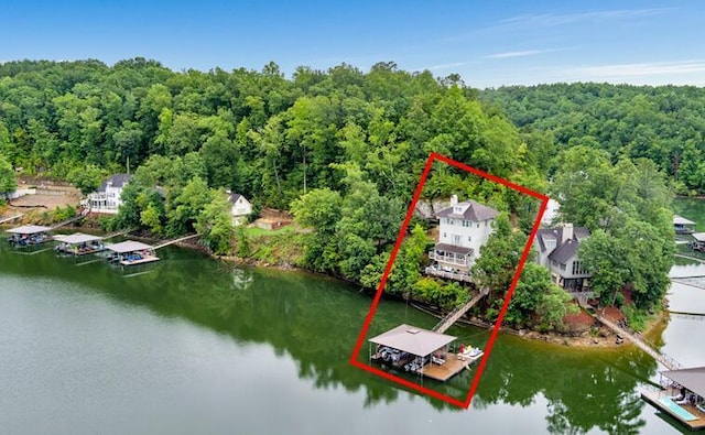 birds eye view of property with a water view