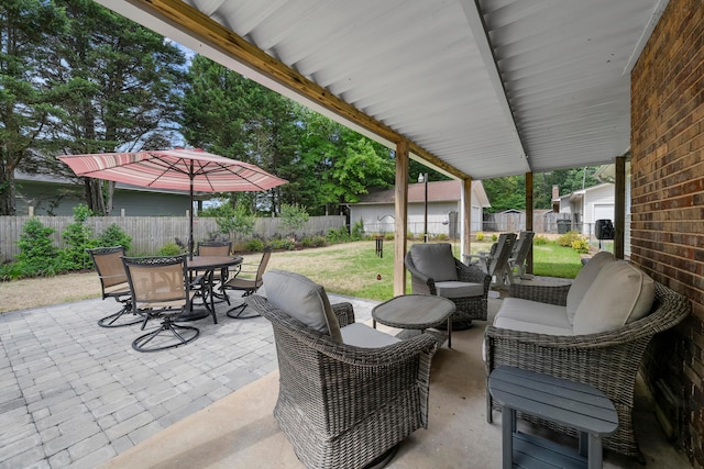 view of patio / terrace featuring outdoor dining space and an outdoor living space