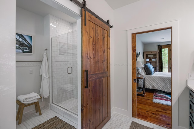 bathroom featuring tile patterned floors, vanity, and walk in shower