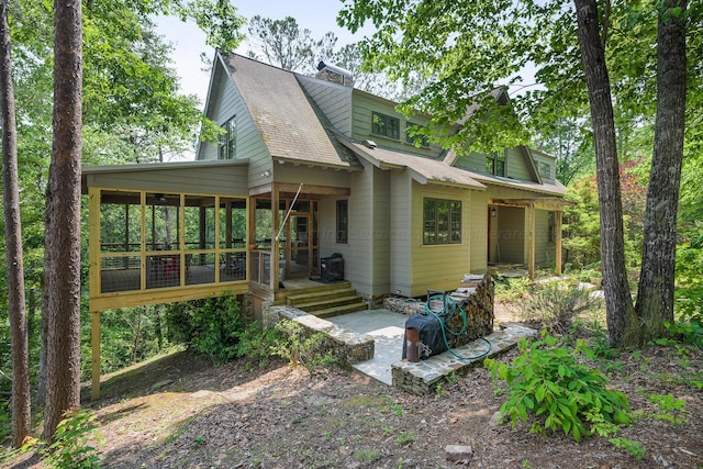 view of front of property featuring a sunroom