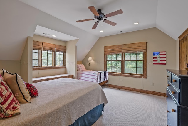 carpeted bedroom with vaulted ceiling, multiple windows, and ceiling fan