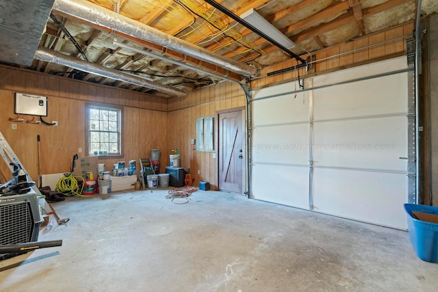 garage featuring wood walls