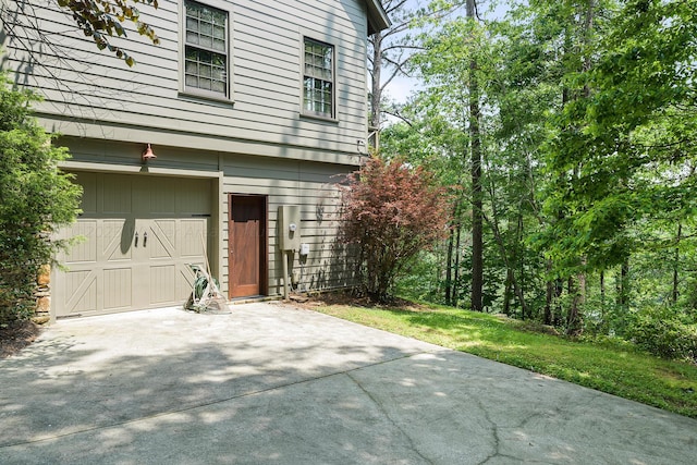 view of side of property featuring a garage