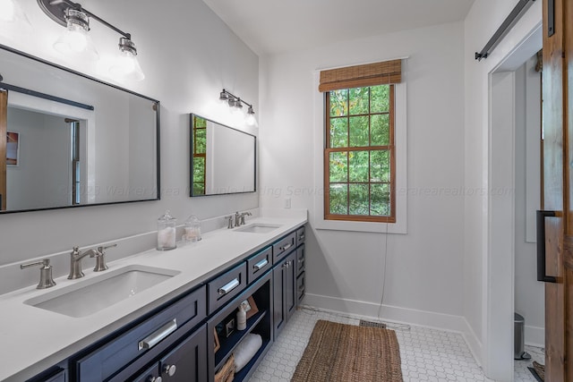 bathroom with tile patterned flooring and vanity