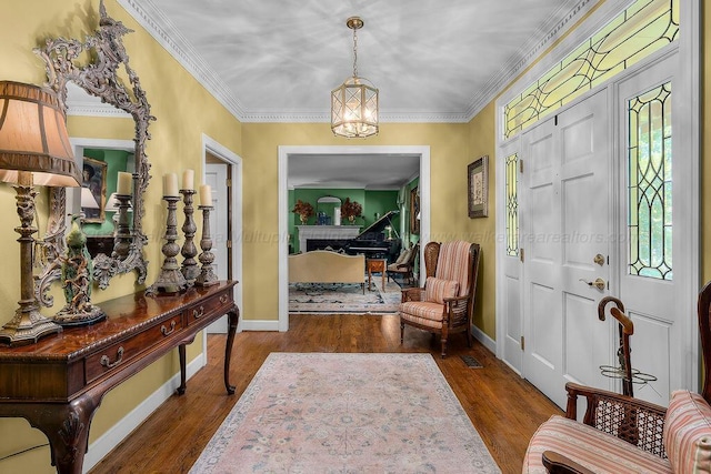 601 Glen Oaks Cir, Jasper, AL 35504 - entrance foyer featuring wood finished floors, ornamental molding, and a chandelier