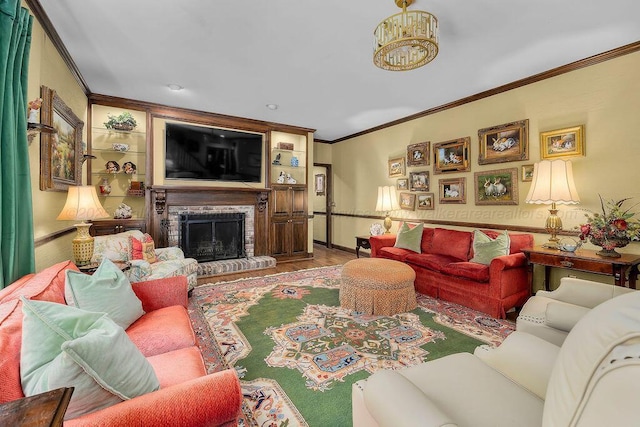 601 Glen Oaks Cir, Jasper, AL 35504 - living area with ornamental molding, wood finished floors, a brick fireplace, and a chandelier