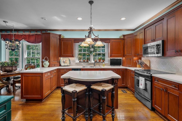601 Glen Oaks Cir, Jasper, AL 35504 - kitchen featuring appliances with stainless steel finishes, a chandelier, plenty of natural light, light countertops, and recessed lighting