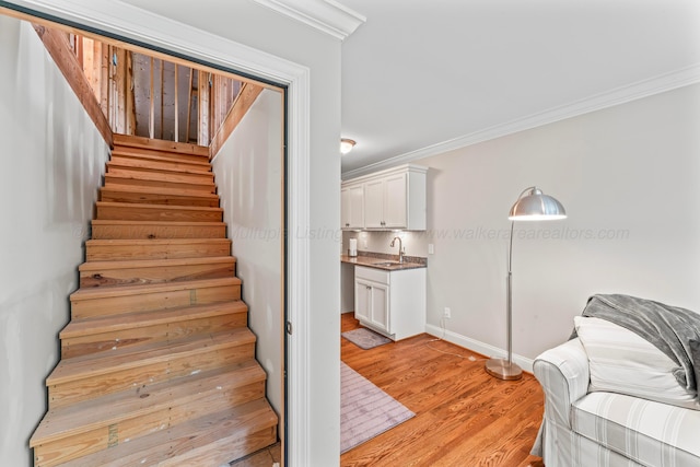 136 Grand Magnolia, Jasper, AL 35504 - stairway with ornamental molding, wood finished floors, and baseboards