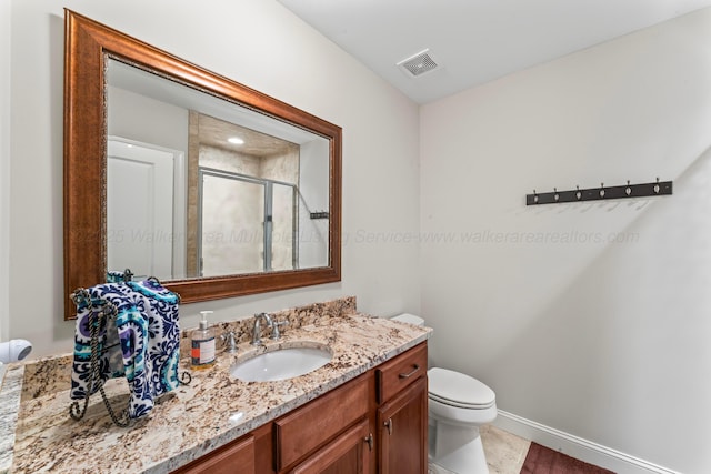 136 Grand Magnolia, Jasper, AL 35504 - full bathroom featuring vanity, toilet, and a stall shower