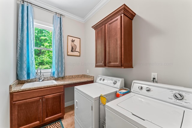 136 Grand Magnolia, Jasper, AL 35504 - laundry room featuring washer and dryer, crown molding, and cabinet space