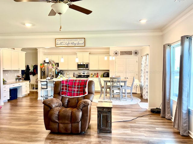 405 Meadow Way, Jasper, AL 35504 - living room featuring a ceiling fan, ornamental molding, and wood finished floors