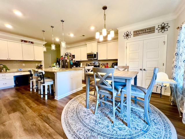 405 Meadow Way, Jasper, AL 35504 - dining space featuring ornamental molding, dark wood-style flooring, and recessed lighting