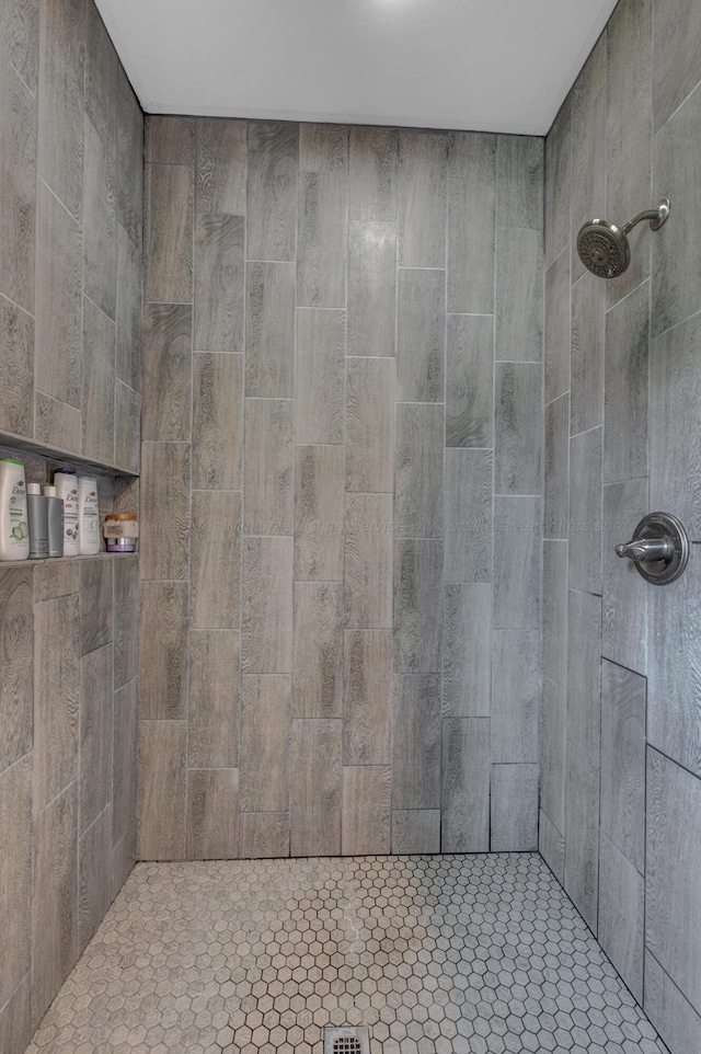full bathroom with a tile shower