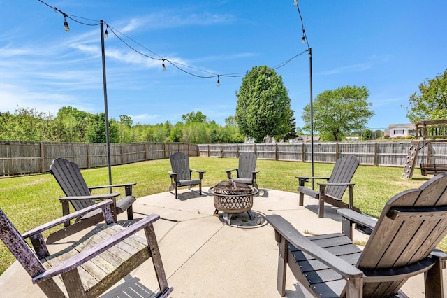view of patio with a fenced backyard and an outdoor fire pit