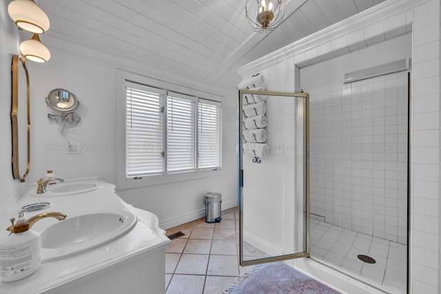 full bathroom featuring tile patterned floors, a sink, vaulted ceiling, and a shower stall