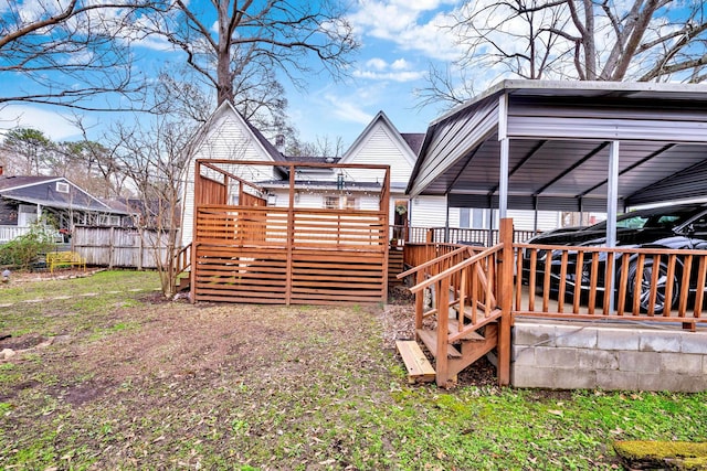 view of yard featuring fence and a wooden deck