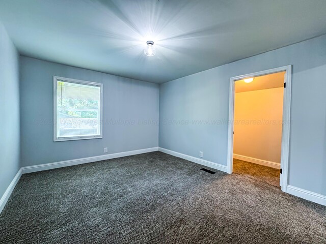 2214 SW 8 Th Ave, Fayette, AL 35555 - spare room featuring dark carpet and baseboards