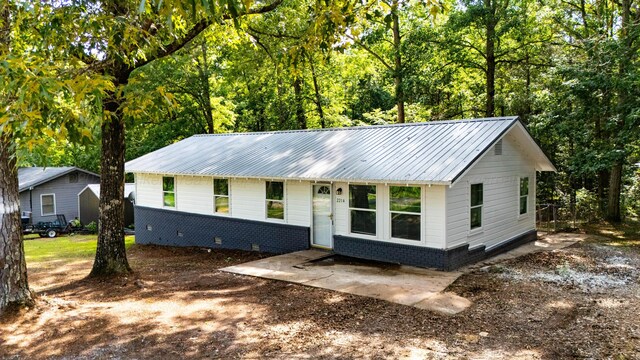 2214 SW 8 Th Ave, Fayette, AL 35555 - view of front of house with crawl space, a metal roof, and brick siding