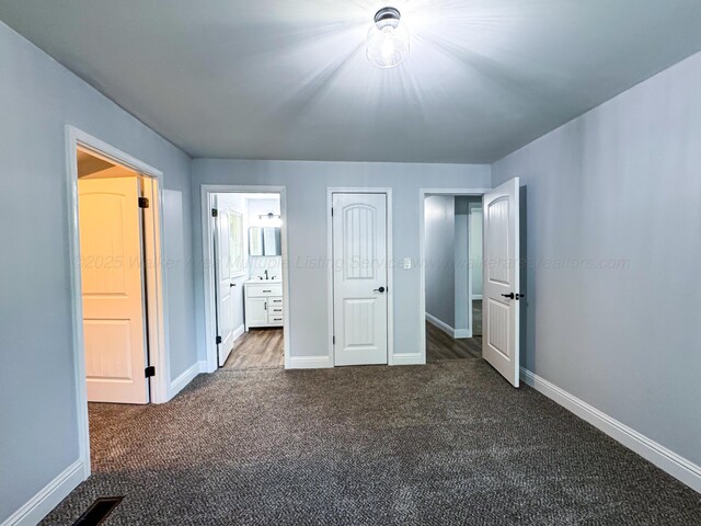 2214 SW 8 Th Ave, Fayette, AL 35555 - unfurnished bedroom with dark colored carpet and connected bathroom