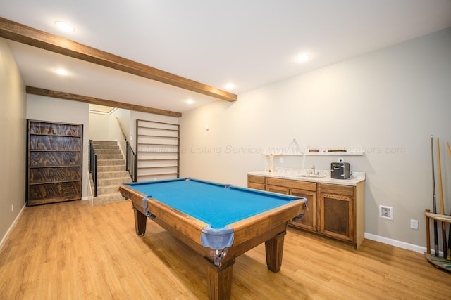 recreation room featuring wet bar, a sink, beamed ceiling, light wood-style flooring, and billiards