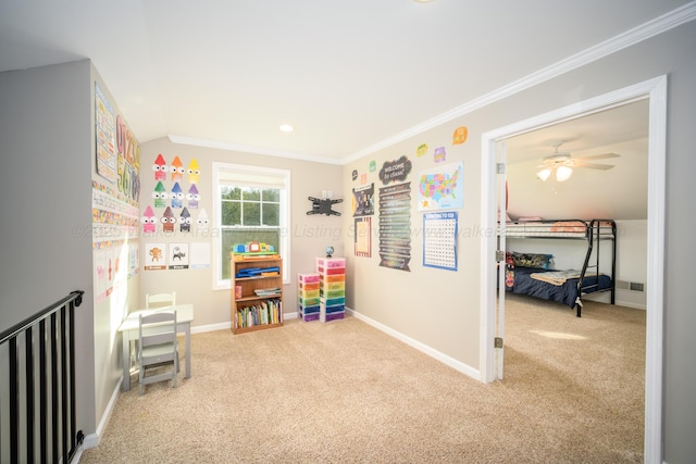 recreation room with baseboards, crown molding, and carpet