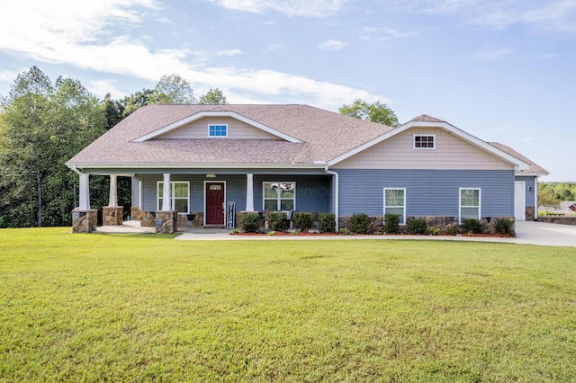craftsman inspired home featuring stone siding, a porch, roof with shingles, and a front lawn