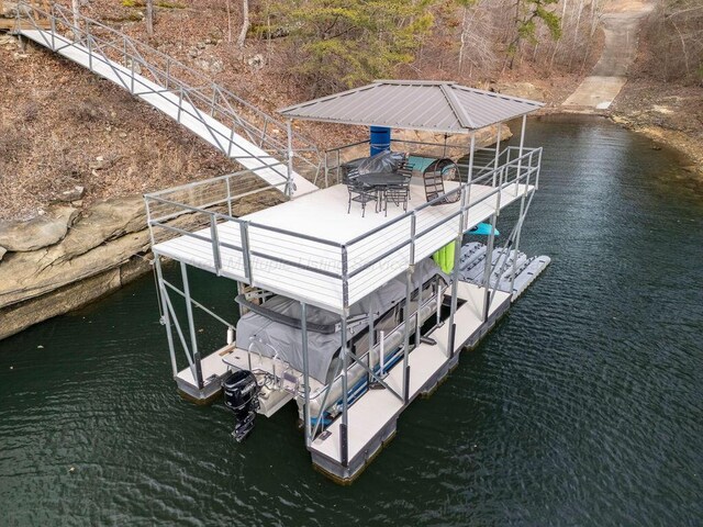 dock area with a gazebo and a water view