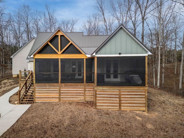 view of front of home featuring a sunroom