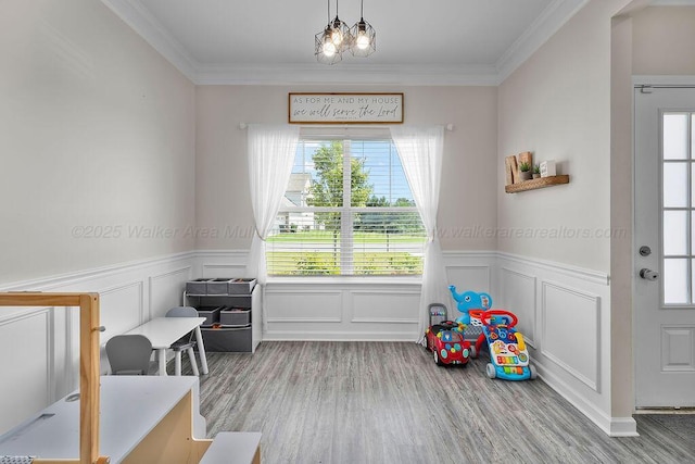 474 Meadow Way, Jasper, AL 35501 - recreation room featuring healthy amount of natural light, a wainscoted wall, wood finished floors, crown molding, and a decorative wall