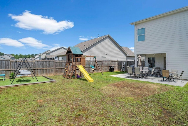 474 Meadow Way, Jasper, AL 35501 - fenced backyard featuring a playground and a patio