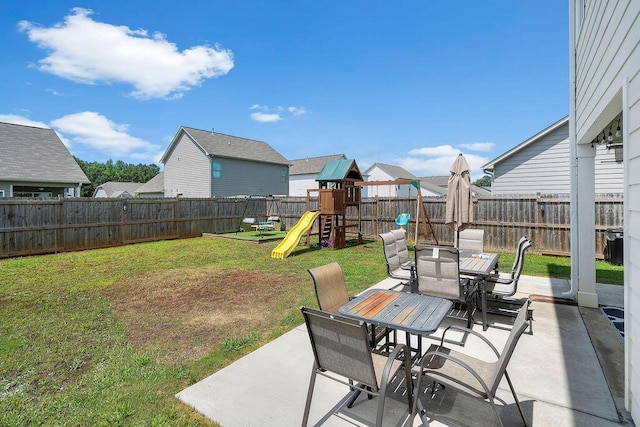 474 Meadow Way, Jasper, AL 35501 - fenced backyard featuring outdoor dining space, a playground, and a patio