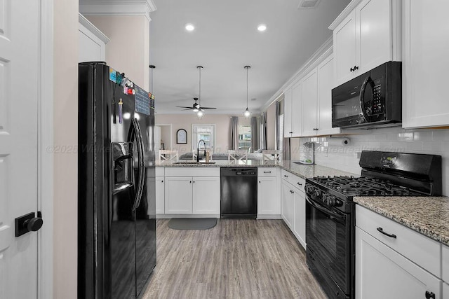 474 Meadow Way, Jasper, AL 35501 - kitchen featuring black appliances, a ceiling fan, white cabinetry, crown molding, and decorative backsplash