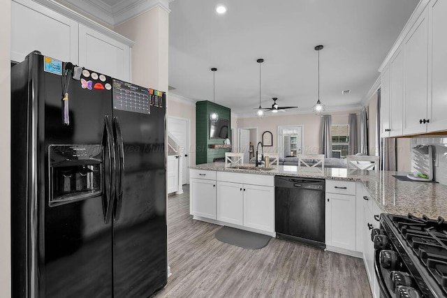 474 Meadow Way, Jasper, AL 35501 - kitchen with black appliances, ornamental molding, a peninsula, a ceiling fan, and white cabinetry